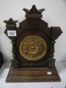 An oak mantel clock,