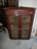 Victorian corner cupboard with leaded glass doors