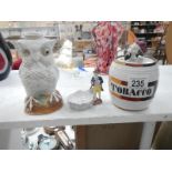 A 19th century Continental porcelain owl oil lamp & tobacco jar (both A/F) & a pipe stand