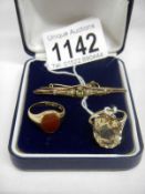 A citrine set 9ct gold ring, a peridot and pearl 9ct gold brooch and a cornelion set 9ct gold ring,