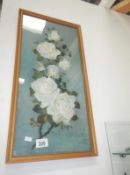 An oil on paper of floral still life signed W.