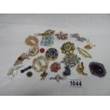 A mixed lot of vintage costume brooches