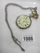 A silver pocket watch on silver chain (over wound)