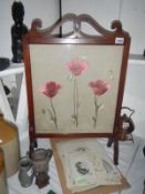An Edwardian mahogany screen embroidered with poppies