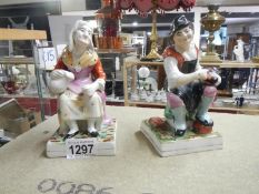 A pair of early Staffordshire figures, Jobson and Nell,