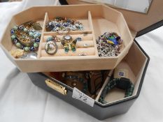 A jewellery box containing costume jewellery