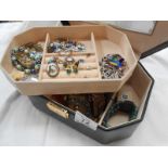 A jewellery box containing costume jewellery