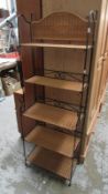 A vintage style folding wrought iron & wicker shelves