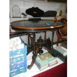 A small Victorian oval black table