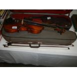 A German violin with 2 bows in distressed case