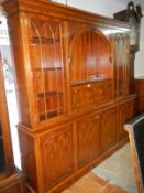 A large dark wood stained sideboard wall unit with glazed doors & cupboard base