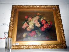 A gilt framed oil on canvas still life of roses bearing signature R.G.