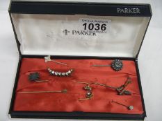8 Victorian stick pins and a crescent brooch