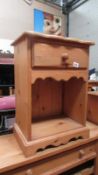 A solid pine open cupboard with single drawer