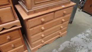 A solid pine 2 over 3 chest of drawers