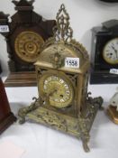 A Victorian brass mantel clock