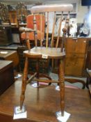 A childs country style Windsor high chair