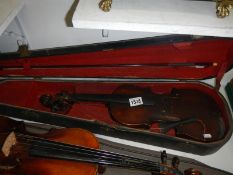 A violin for restoration with bow and case