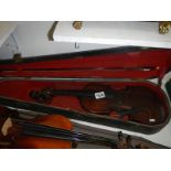 A violin for restoration with bow and case