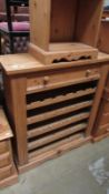 A solid pine wine/bottle rack with drawer (35 bottle capacity)