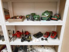 A collection of action figures & vehicles