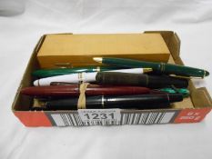 A large collection of vintage pens and pencils including silver