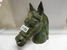 An old cast bronze horses head