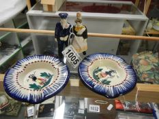 A 1930's Quimper figure group (slight chipping) and a pair of Quimper ashtrays,