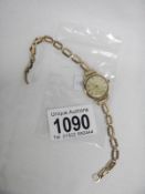 A cased Cyma ladies wrist watch with 9ct gold strap