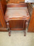A modern mahogany Davenport with 4 darwers either side
