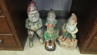 A family of 4 vintage garden gnomes