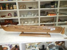 A vintage hand made wooden model of a rowing gig