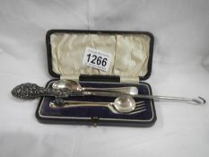 A cased silver spoon and fork,