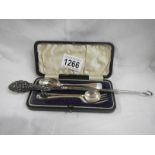 A cased silver spoon and fork,