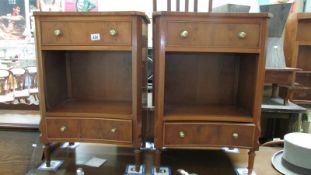 A pair of teak effect bedsides with 2 drawers & open space