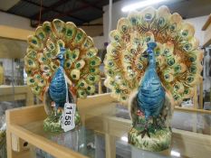 A rare pair of Victorian peacock spill vases, a/f,