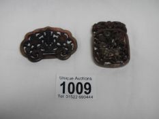 2 Oriental carved stone brooches