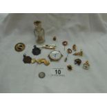 A quantity of miscellaneous badges, watch fobs, cufflink's, coins,