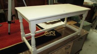 A cream painted coffee/side table