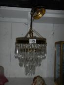 A 3 tier glass dropper chandelier