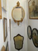 A 19th century wood framed mirror with sconces and another later mirror