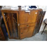 An Edwardian astragal glazed display cabinet with bureau centre