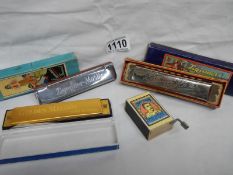 2 old boxed harmonica's and a matchbox music box
