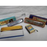 2 old boxed harmonica's and a matchbox music box