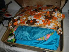 A vintage retro case with a collection of 1950/60's swimwear and a 1960's swim bag