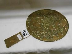 An early Victorian brass Chinese hand mirror