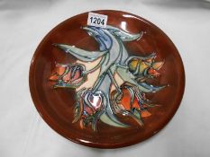 A 1993 Moorcroft Sally Tuffin tulip design plate