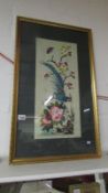 A tapestry picture of a blue bird,