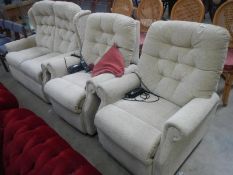 A 2 seater 3 piece suite with 2 electric reclining chairs
