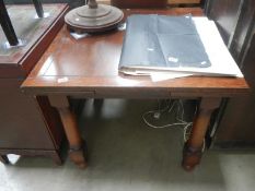 An oak draw leaf table with turned legs